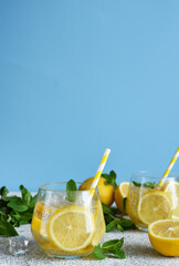 Cold lemonade with mint and lemon juice. Fresh summer drink. Mahito with lemon.