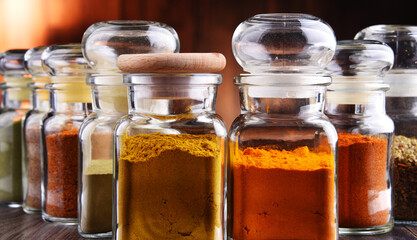 Glass storage jars with spices and herbs
