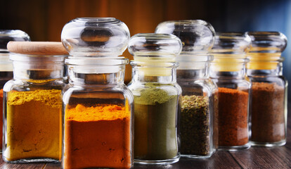 Glass storage jars with spices and herbs