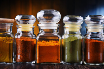Glass storage jars with spices and herbs