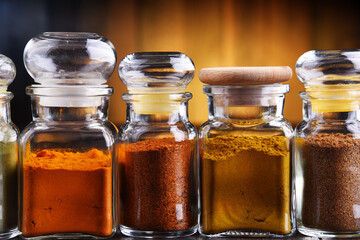 Glass storage jars with spices and herbs