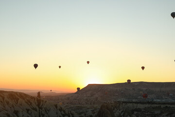 
dawn with balloons in the sky