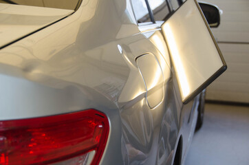 Process Of Paintless Dent Repair On Car Body. Big Dent On Rear Car Fender. PDR Removal Course Training. - obrazy, fototapety, plakaty