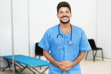 Attractive mexican male doctor is ready for vacinating patients