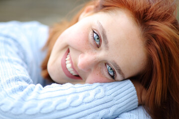 Beautiful woman with blue eyes looking at camera