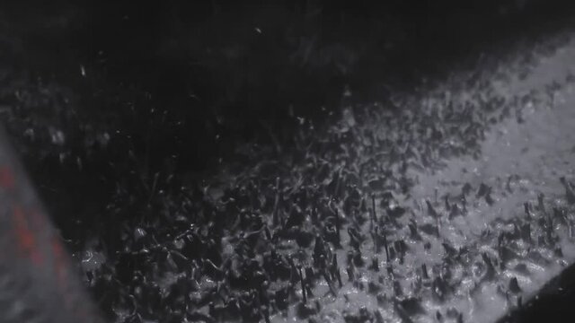 Oil rig shale shaker separating cuttings from drilling mud in slow motion
