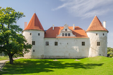 Bauska city castle in Latvia up in the hill. Sunny autumn day.