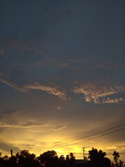 A photograph of the sky with a golden sunset.