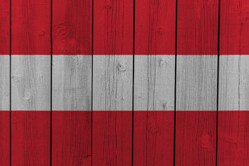 The National Flag of Austria painted on a wooden wall. 