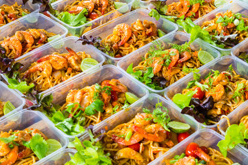 Thai food lunch boxes in plastic packages, Pad Thai Noodles.