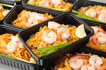 Thai food lunch boxes in plastic packages, Pad Thai Noodles.
