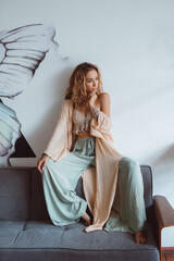 Obraz premium Beauty woman posing in the cafe, outdoor portrait, hippy dress, boho style, dreadlocks, fashion model, pretty woman, cute, coffee, glasses, tattoo