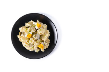 Potato salad with gherkins, egg and mustard isolated on white background. Copy space