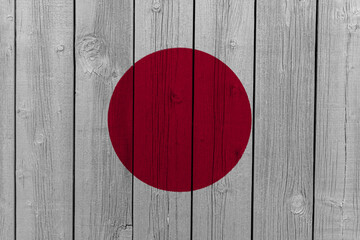 The National Flag of Japan painted on a wooden wall. 