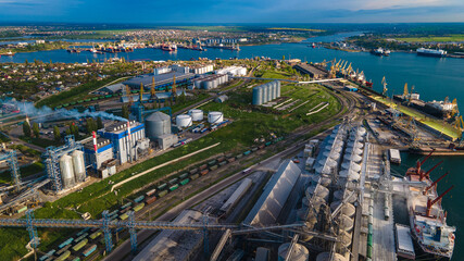 Fototapeta na wymiar Industrial port in the field of import-export global business logistics and transportation, Loading and unloading container ships, cargo transportation from a bird's eye view.