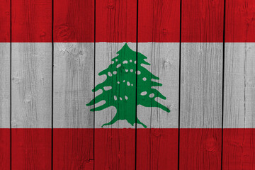 The National Flag of Libanon painted on a wooden wall. 