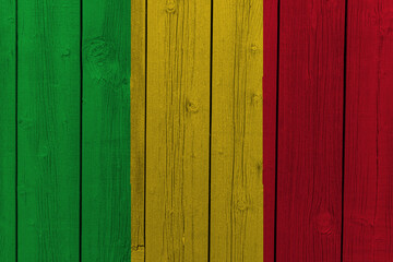 The National Flag of Mali painted on a wooden wall. 