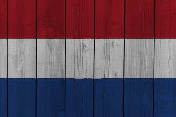 The National Flag of the Netherlands painted on a wooden wall. 
