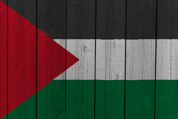 The National Flag of Palestinian Authorities painted on a wooden wall. 