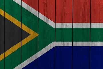 The National Flag of South Africa painted on a wooden wall. 