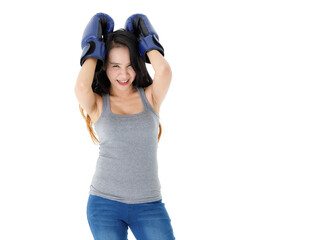 Confident sportive woman in boxing gloves