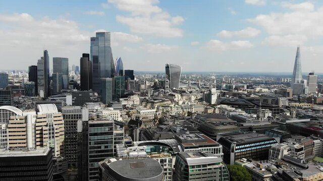 Rotating aerial view of London Financial and Banking district on a sunny day
