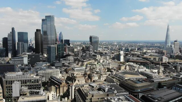 Reverse aerial view of London Financial and Banking district and the Shard on a sunny day
