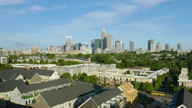 Aerial View of Condo Buildings in Charlotte, North Carolina. Downtown City Skyline in Background on Beautiful Summer Day.