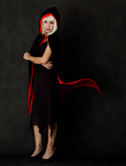 Woman in black and red sorceress cape