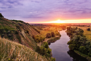 Fototapeta na wymiar beautiful summer landscape sunrise over river with green meadow