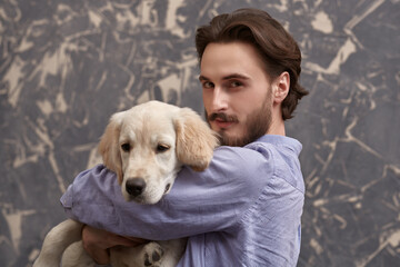 lovely puppy and a man