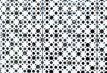 Abstract black and white metallic background with round holes, many circles copy space, textured