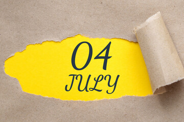 july 04. 04th day of the month, calendar date.Hole in paper with edges torn off. Yellow background is visible through ragged hole.Summer month, day of the year concept