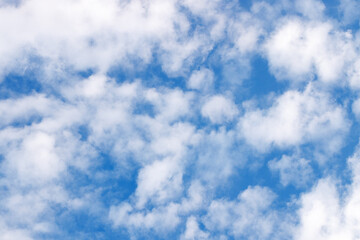 Background of cirrus cumulus clouds in a blue sky.