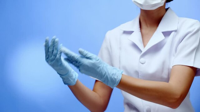 A nurse forms a heart, love symbol, with her hands and fingers then displays copy space for your message
