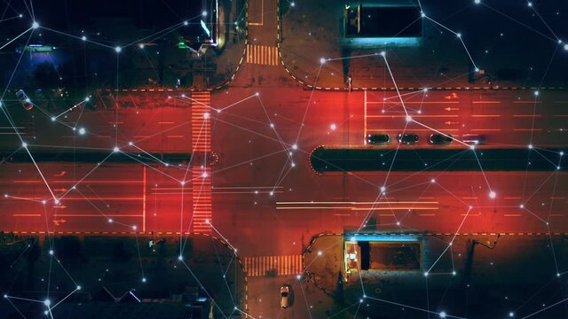 Concept of mobile Internet network in futuristic city: traffic at the crossroads of the night city, timelapse. Plexus Neural network over the night road above the traffic. Aerial Dynamic zoom shot.