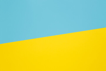 Two-color background made with diagonal line. Yellow and light blue colorway