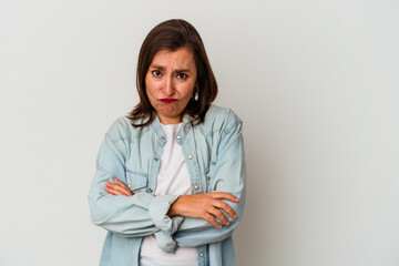 Middle age caucasian woman isolated on white background blows cheeks, has tired expression. Facial...