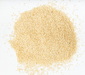 view of pile of amaranth grains close up on gray