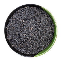 black sesame seeds in round bowl isolated
