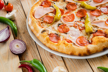 tasty pizza on the wooden background