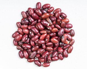 pile of raw mexican red beans close up on gray