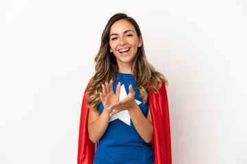 Super Hero woman over isolated white background applauding after presentation in a conference