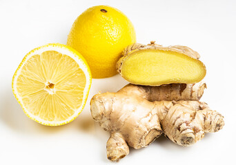 whole and cut ginger roots and cross-cut lemon