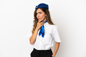 Airplane stewardess over isolated white background having doubts and with confuse face expression