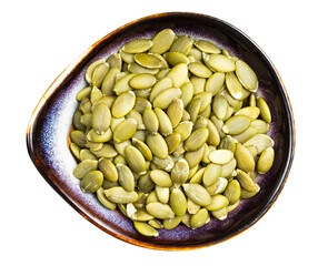 peeled pumpkin seeds in ceramic bowl isolated