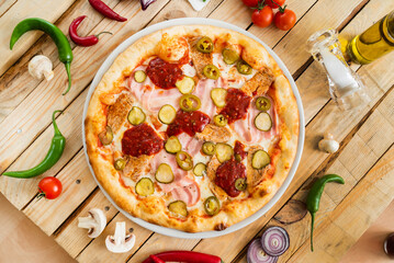 tasty pizza on the wooden background