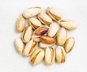 pile of shelled and ripe pistachio nuts close up