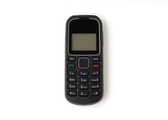 Old and outdated mobile phone isolated on white background.