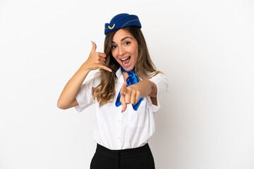Airplane stewardess over isolated white background making phone gesture and pointing front